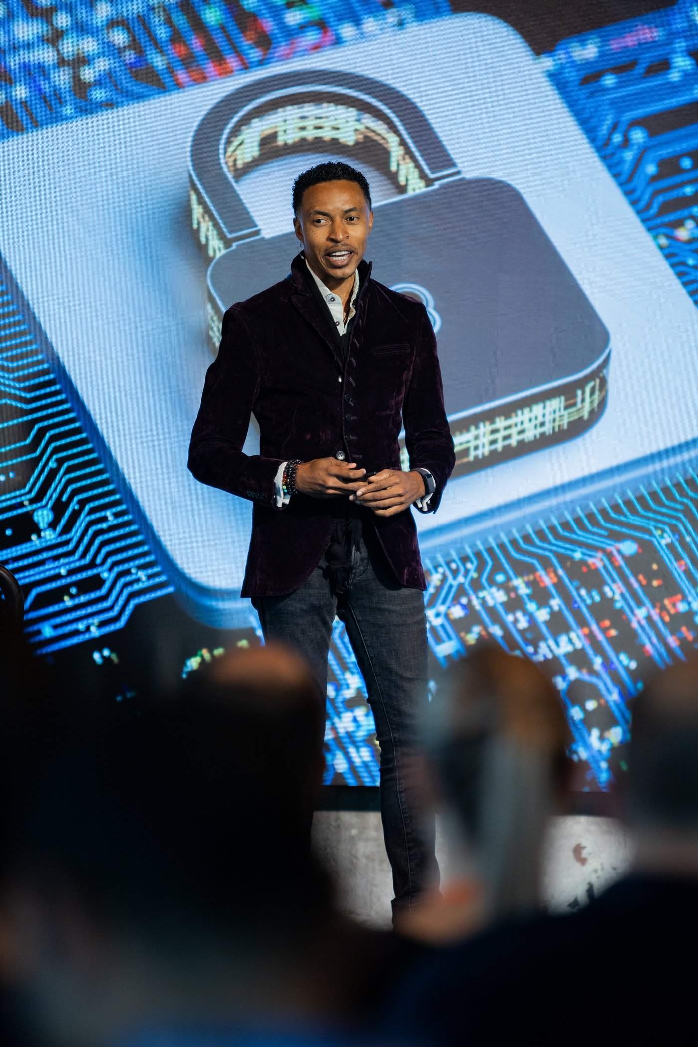 Corey White on stage, cybersecurity veteran and author